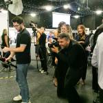 This is a photo of the Leeds college of Building BIG Awards 2026. This photo depicts a photography crew preparing their equipment at the award's photo wall.