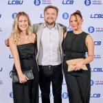 This photo depicts a staff team photo against the LCBU photo wall.