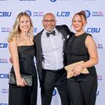 This photo depicts a staff team photo against the LCBU photo wall.