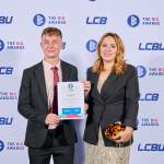 This photo depicts a student with their award against the LCBU photo wall.