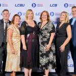 This photo depicts a staff team photo against the LCBU photo wall.