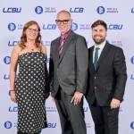This photo depicts a staff team photo against the LCBU photo wall.