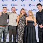 This photo depicts a staff team photo against the LCBU photo wall.