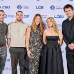 This photo depicts a staff team photo against the LCBU photo wall.
