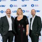 This photo depicts a staff team photo against the LCBU photo wall.