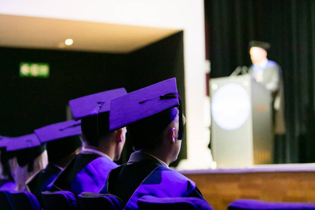 LCBU Graduates listening to Assistant Principal Chris Tunningley.
