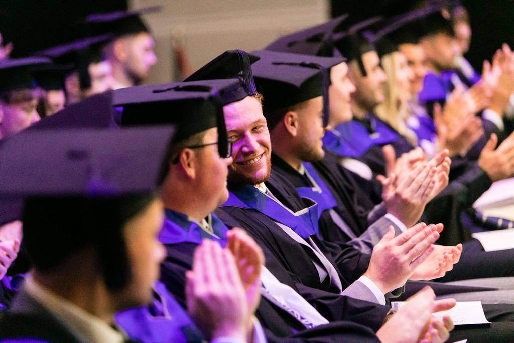 LCBU Graduates applauding.