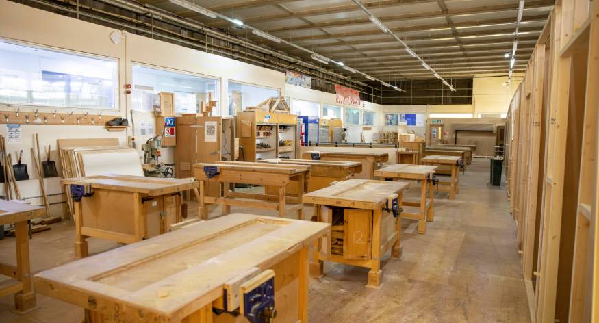 Empty joinery workshop showing workbenches